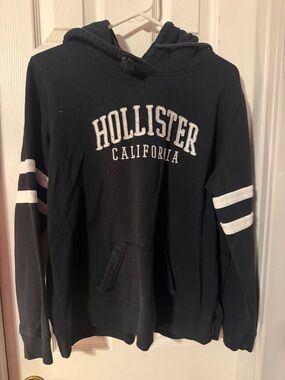 Hollister Black Pullover Hoodie with White Sleeve Stripes